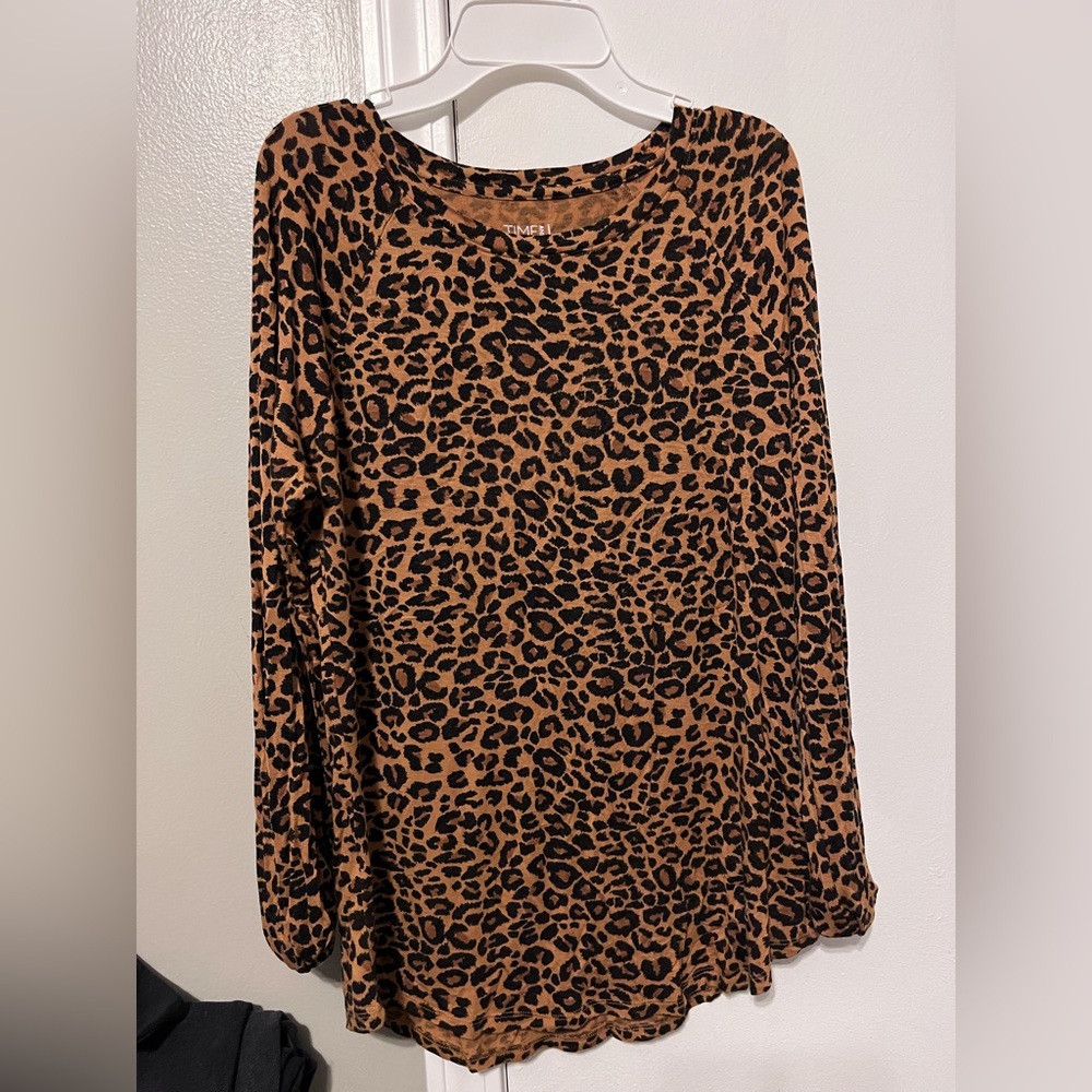 Long sleeve cheetah shirt.